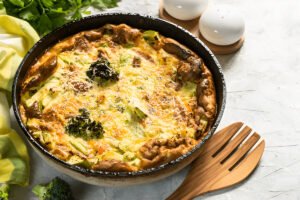 Organic Mama Veggie Frittata served in a cast iron skillet.